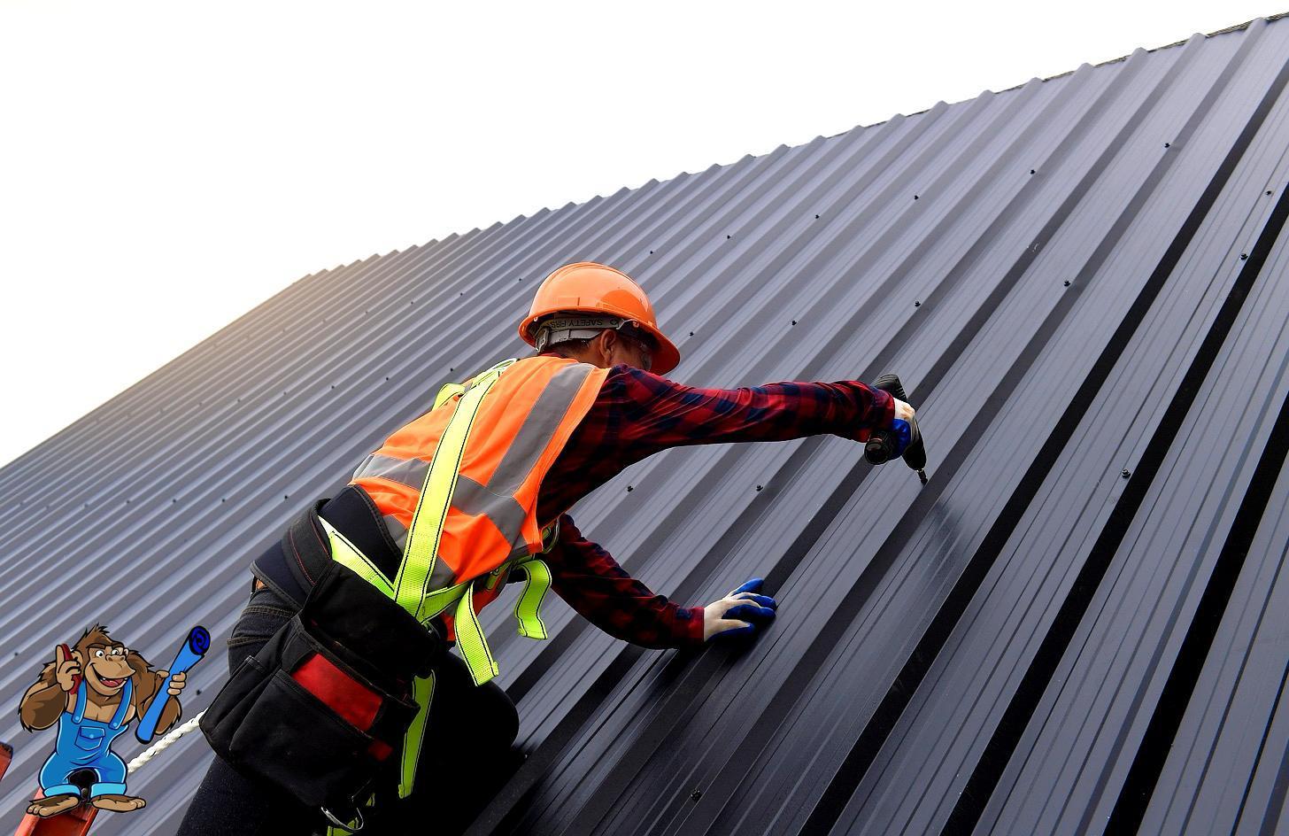 Construction worker installing metal roofing for Gorilla Building project